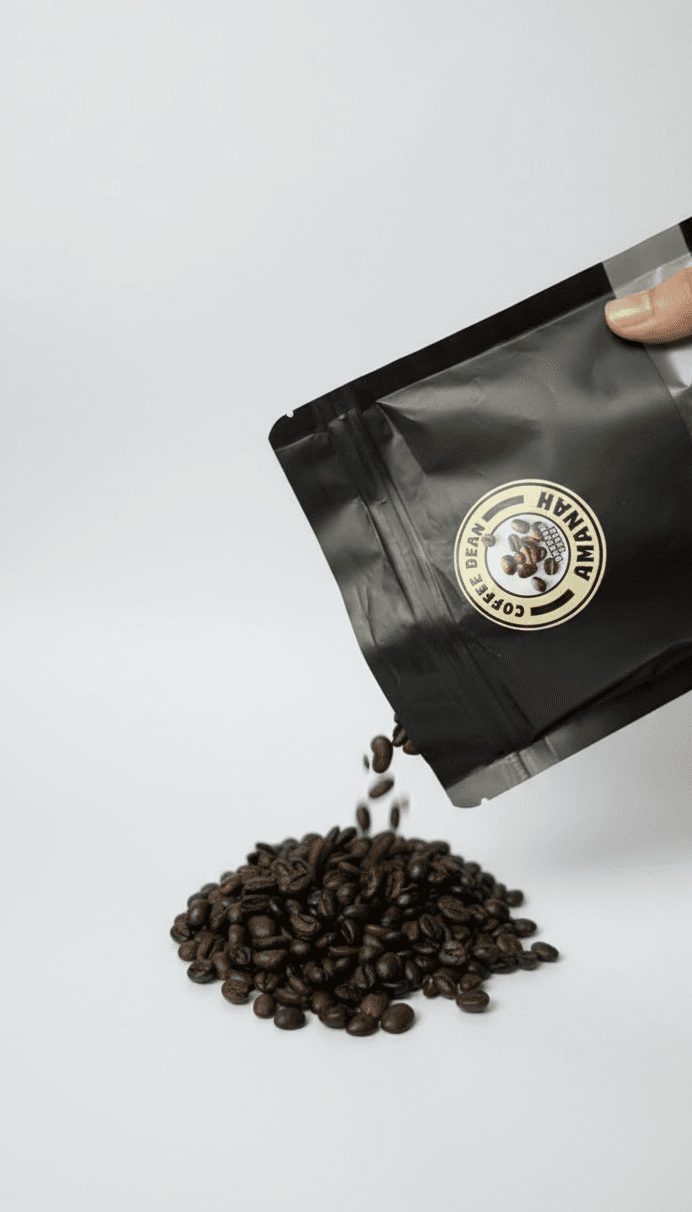 Premium roasted beans being poured from a scoop.